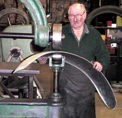 Tradesman Wheeling an arch into shape